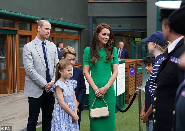 July 16, 2023: Prince William, Kate, Prince George and Princess Charlotte speak to ball kids at the All England Club during the Wimbledon Championships.