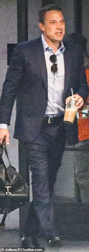 The actor enjoyed an iced coffee on his way out.