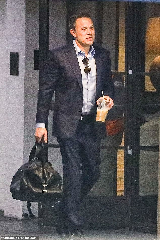 After parking his vehicle, Ben walked across the parking lot wearing leather shoes and carrying a black bag in his hand.