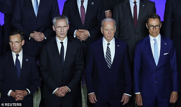 US President Joe Biden (center), NATO Secretary General Jens Stoltenberg (left), and Finnish President Alexander Stubb (right) pose for a photo on NATO's 75th anniversary