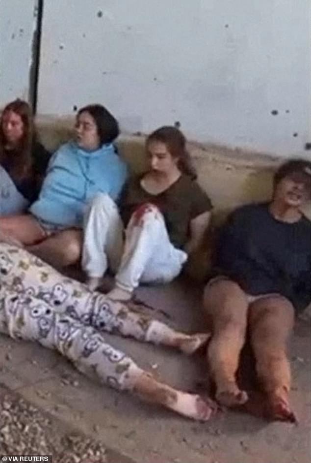 Israeli soldiers Liri Albag, Agam Berger, Daniela Gilboa and Naama Levy sit on the ground during their capture by Hamas soldiers at the Nahal Oz military base in southern Israel on October 7, 2023, in this screenshot taken from a video posted on May 22, 2024.