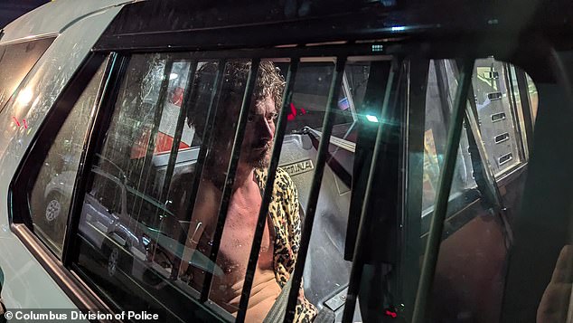 Pancake is pictured in the back of a police patrol car.