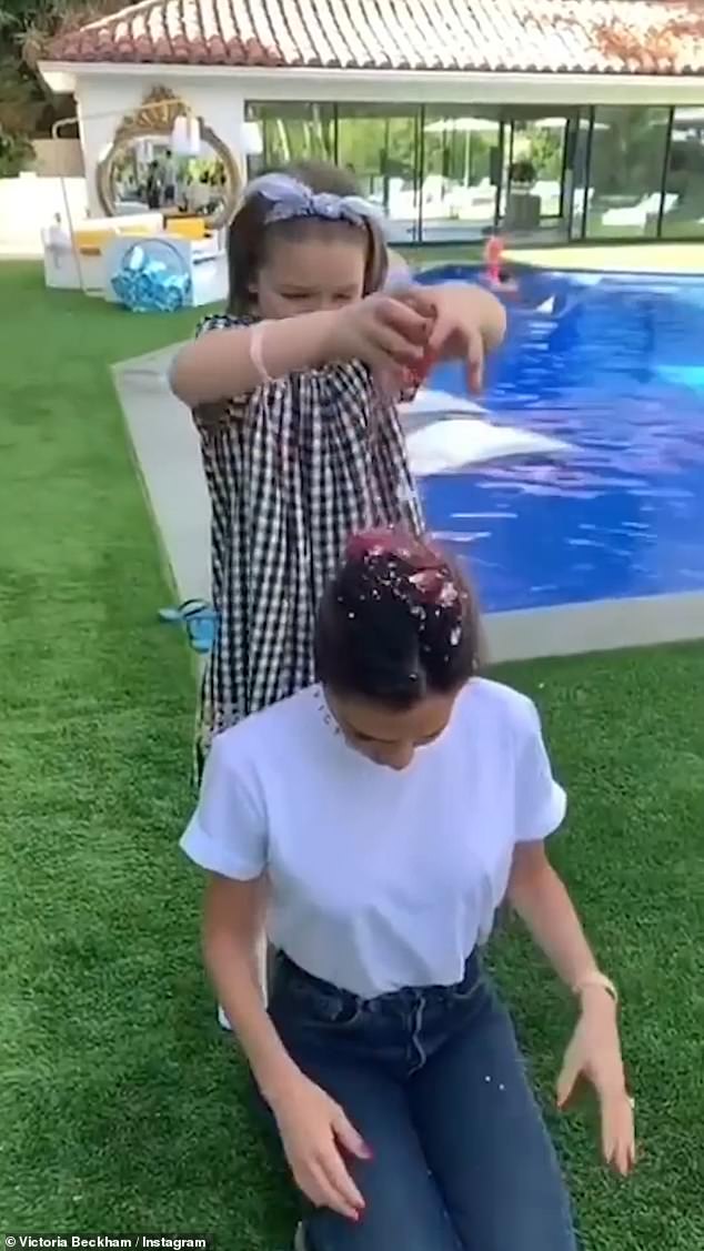 Another snap saw them playing in the garden as Harper threw sparkles into Victoria's hair.