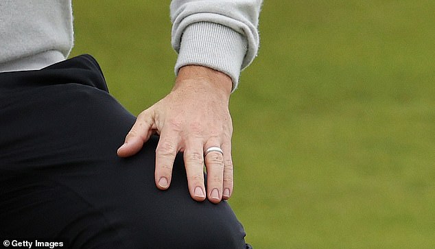 McIlroy was seen playing with his wedding ring amid his reconciliation with wife Erica Stoll