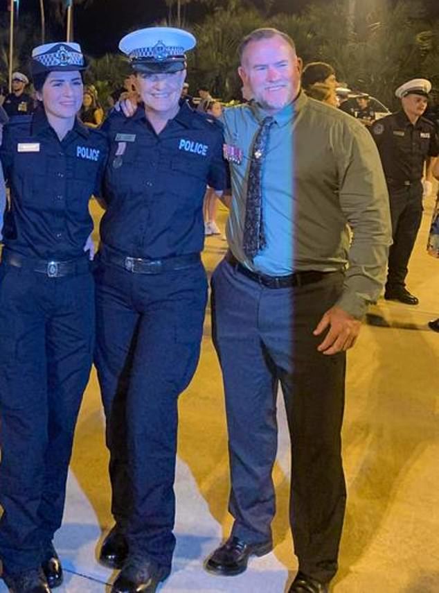 Chris (pictured right) and Jenny Hopper (pictured center) at their daughter Charlee's police graduation