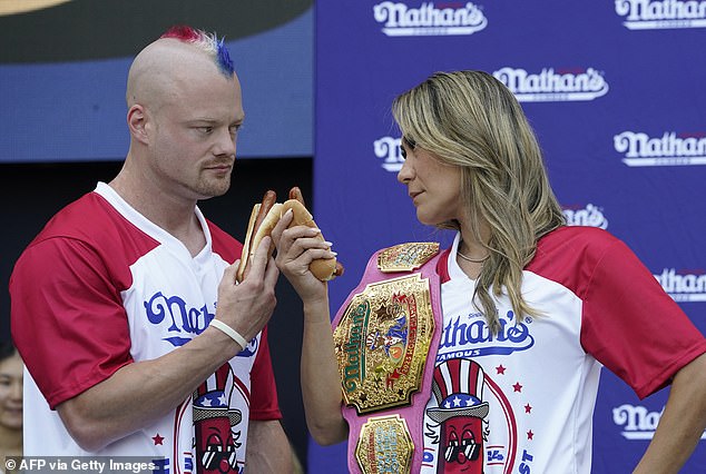 Nick Wehry and Miki Sudo stare at each other during a weigh-in before the July 4 event