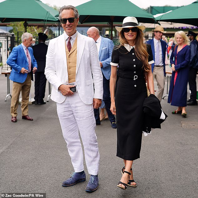 He paired the sleek two-piece set with a sand-coloured vest and sported a burgundy polka dot tie.