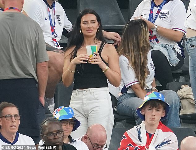 The 30-year-old WAG cut a casual figure as she stood in the Dortmund stands to cheer on the Three Lions as they take on the Netherlands to hopefully secure a place in the final.