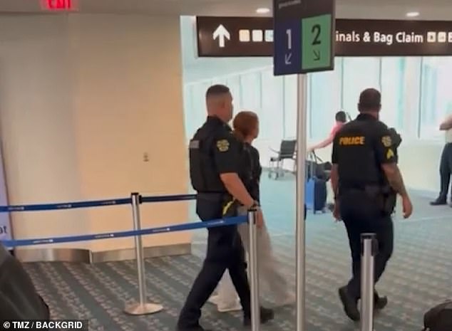 More videos after the plane landed in Orlando showed the woman being taken out of the airport by police.