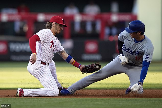 After stealing second base, Ohtani proceeded to brush dirt off his left batting glove.