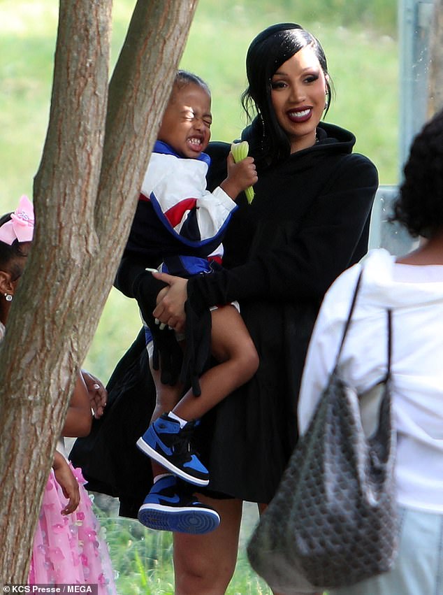 The Grammy Award-winning rapper, 31, was seen cradling her two-year-old son Wave as they checked out the animal enclosures.