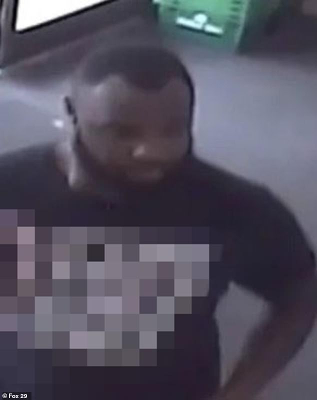 The suspect is described as a black man, between 25 and 30 years old, approximately six feet tall, with a receding hairline and a full beard.