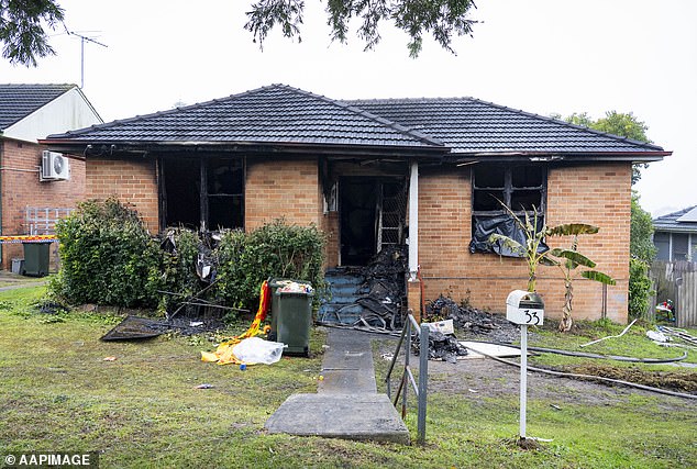 Police allege she locked the doors to her children's bedrooms after starting fires in the rooms and fought with rescuers trying to get her family out of the house (pictured)