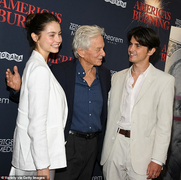 Her son and daughter coordinated elegant outfits in shades of beige and white.