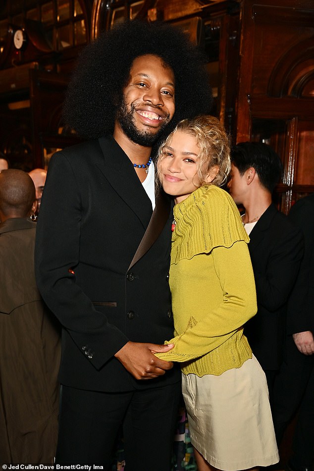 The glamorous artist posed with celebrated writer Harris in London's West End.