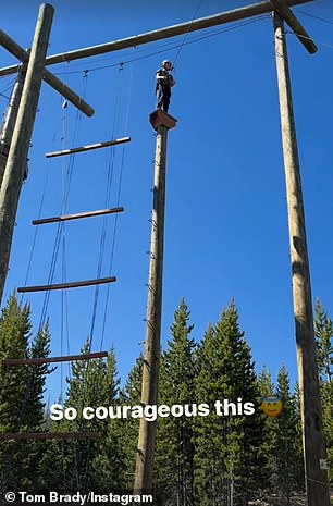 Tom's children proved surprisingly brave, as an Instagram Stories clip showed Vivian high above the treetops on a small platform.