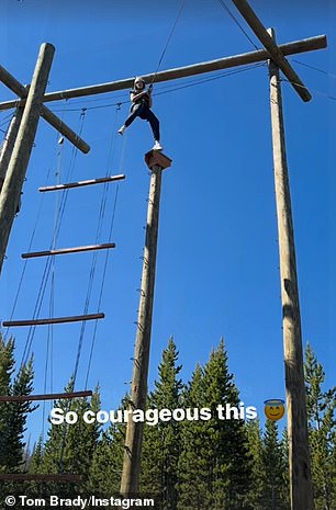 She was hooked up to a harness and jumped off it to swing through the air.