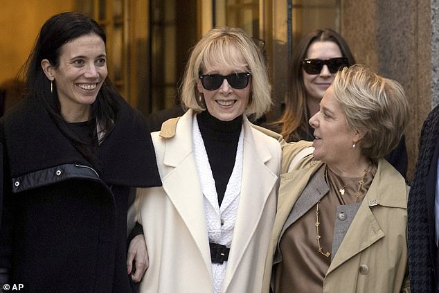 E. Jean Carroll (center) leaves a federal court in New York City on January 26, 2024 after a jury awarded her $83.3 million in a case against former President Donald Trump.