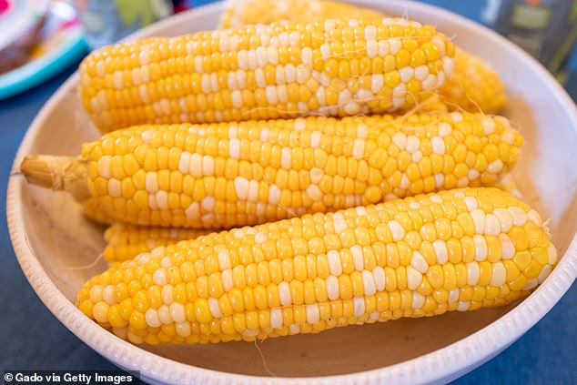 Sanchez's friend waited until the corn cob was warm before covering it with butter, which she rubbed between her hands.