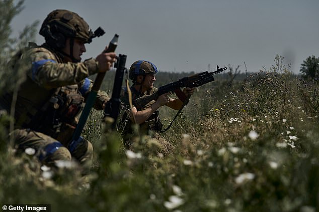 Ukrainian infantry fires at Russian positions on the front's zero line in prepared trenches 100 meters from Russian trenches on July 5, 2025 in the direction of Toretsk region.