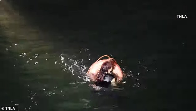 She was seen paddling in the water as officers aboard a Los Angeles Sheriff's Department boat attempted to rescue her by tossing a floating donut into the ocean.