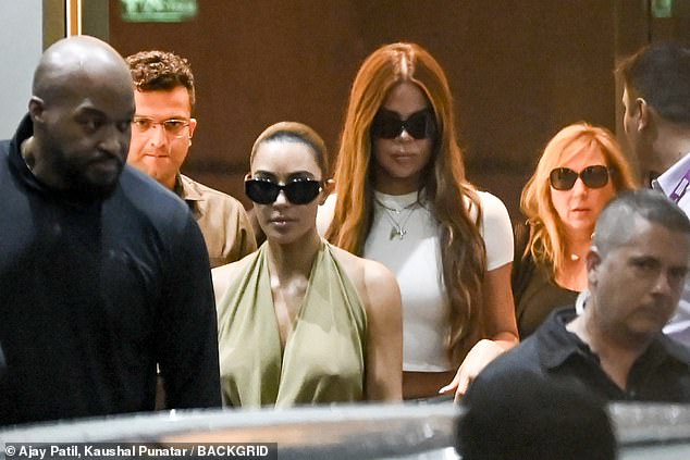 Following her flight, the mother of four, who kept her eyes protected under a pair of oversized black sunglasses, opted to wear her dark locks in a tight, sleek bun.