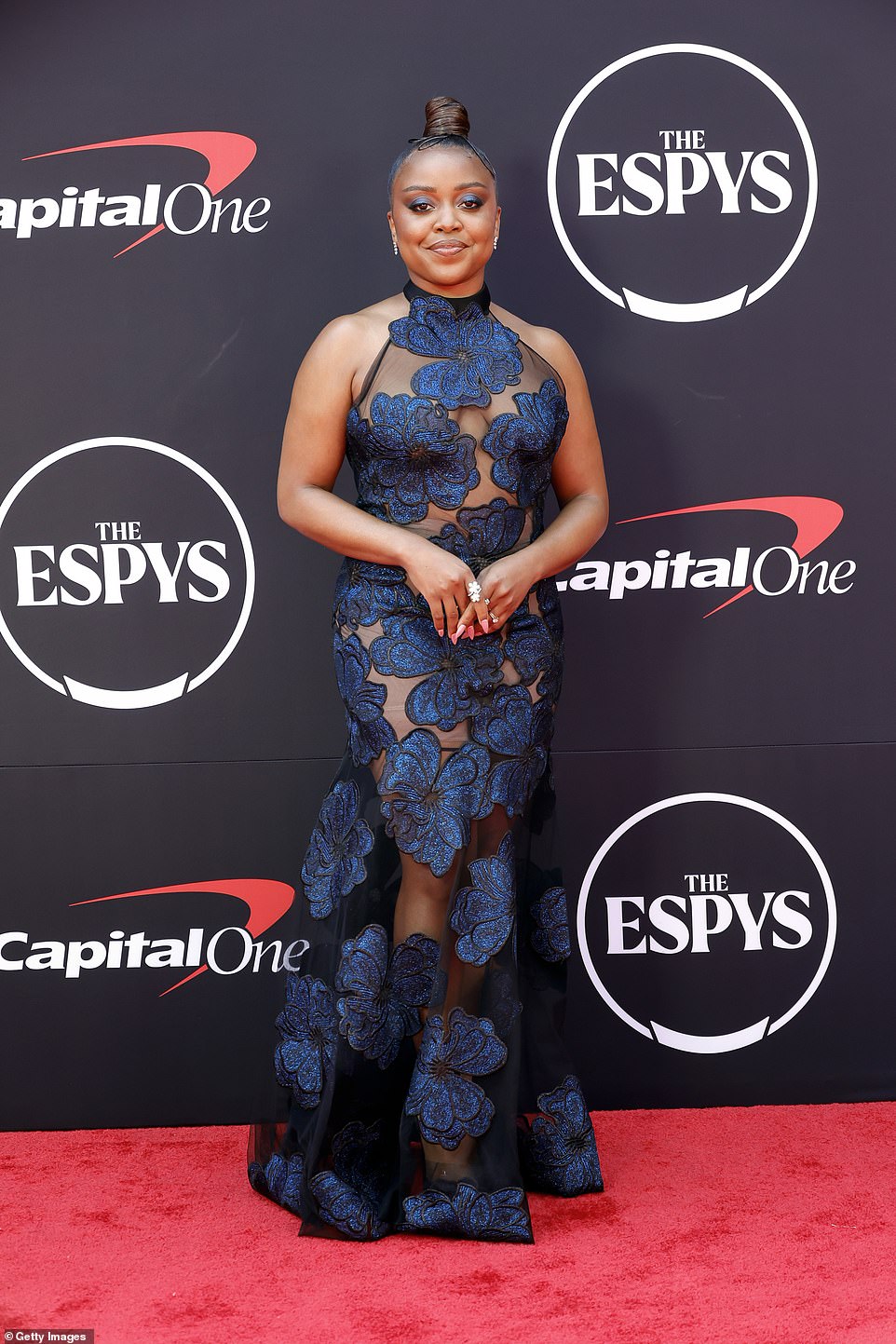 Quinta Brunson, 34, dazzled in a blue beaded gown with sheer panels and a floral print.