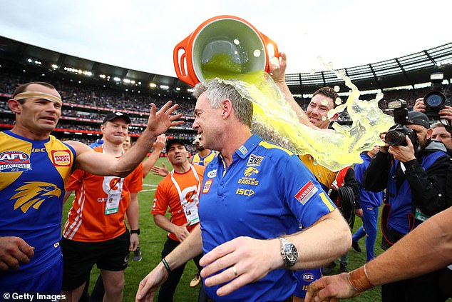 McGovern serves Simpson Gatorade after the club won the 2018 AFL Grand Final