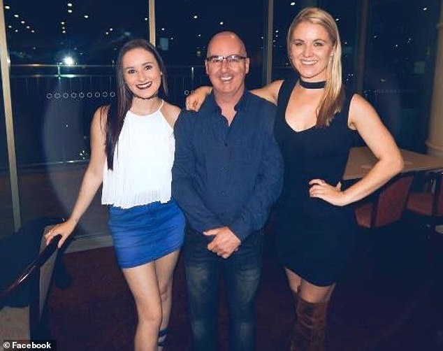 David Fisk is pictured with his twin daughters, Lacinda and Brittany.