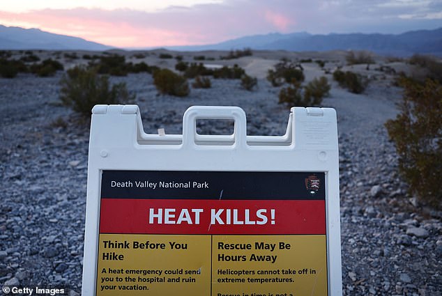 A sign that says "Heat kills!" It is observed during a long-lasting heat wave that is affecting much of California.