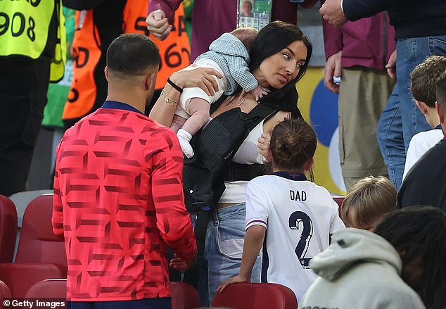 Annie Kilner had a cold reunion with Kyle in the stands after their epic penalty shootout win in Germany, which was down to the 