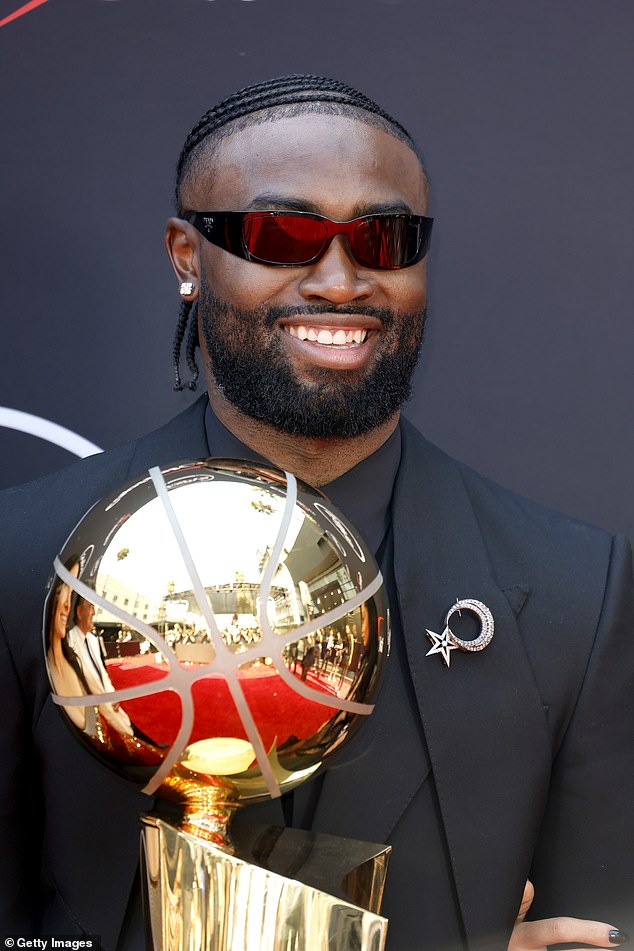 Brown appeared on the red carpet in Los Angeles with the Larry O'Brien trophy in hand