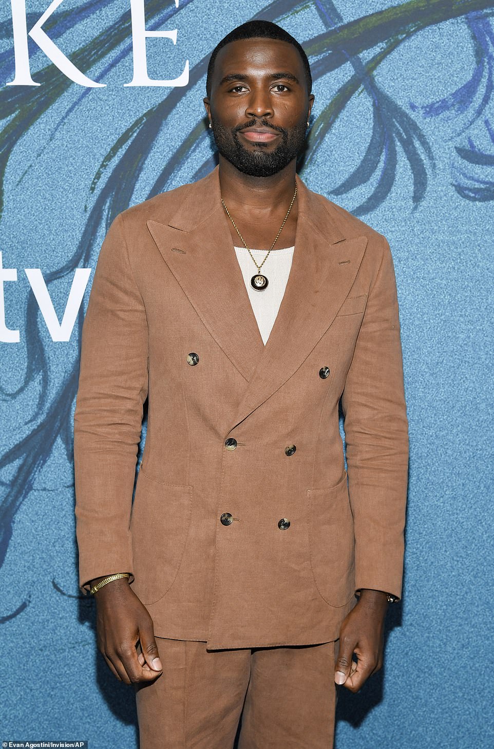 The Brooklyn native stepped out in style, dancing the step and repeat with his colleagues wearing a textured tan suit.