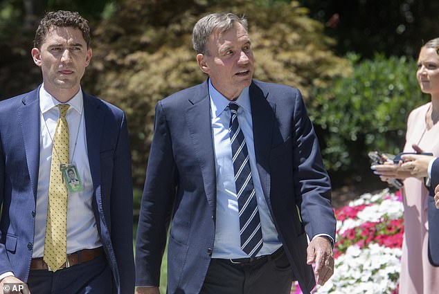 Sen. Mark Warner, D-Va., who canceled an event to speak about Biden earlier this week, did not take questions before entering the private meeting.