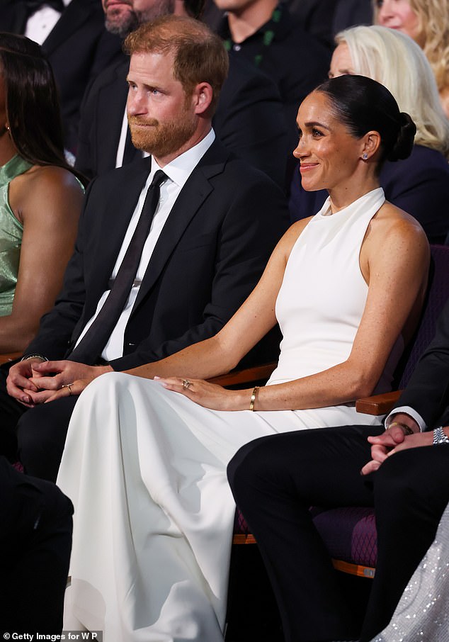 She held her husband's hand at the event as he was nominated for the prestigious Pat Tillman Award, wearing her gold Cartier Love bracelet worth £5,000.