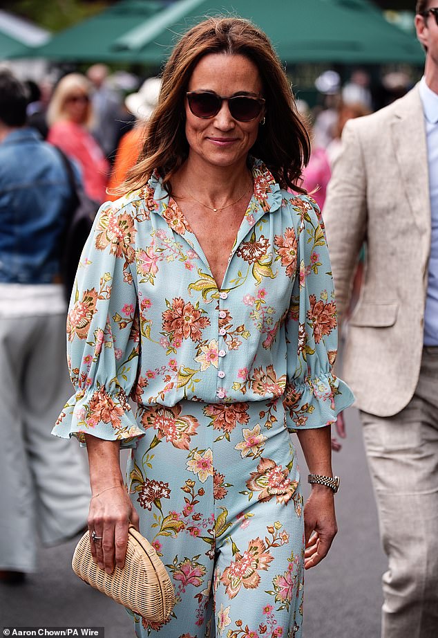 It's all about accessories: Pippa looked chic in a pair of sunglasses and a delicate necklace.