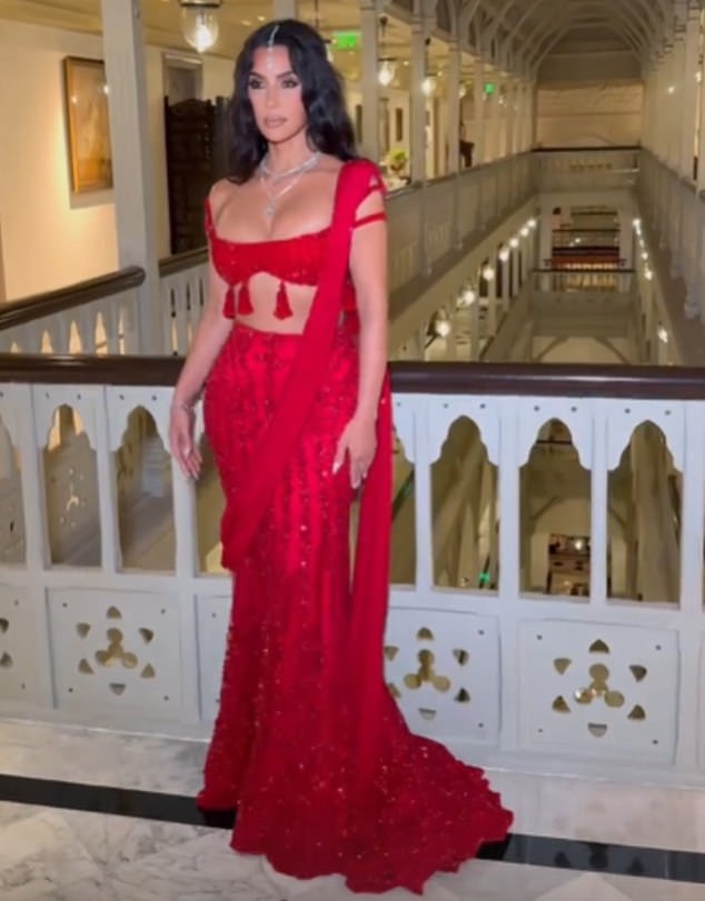 1720802083 891 Kim Kardashian stuns in a sparkling ruby ​​red ensemble while