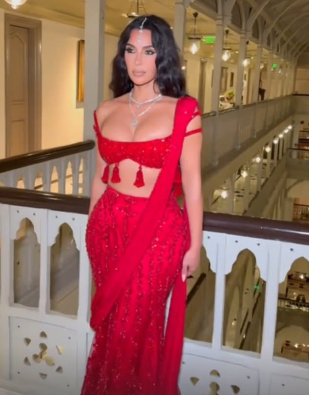 The reality TV star wore stacked diamond necklaces and a diamond pendant that rested on her forehead. Kardashian's hair was styled in natural-looking waves and her makeup was camera-ready.