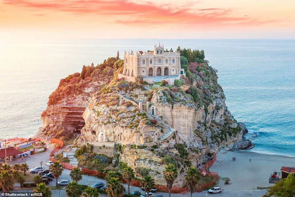 Above is the spectacular cathedral of Santa Maria dell'Isola di Tropea, perched atop a rocky cliff surrounded by the Tyrrhenian Sea.