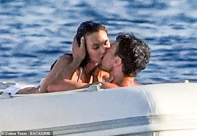 DiCaprio's bikini-clad girlfriend, 26, sat on top of the British star, 39, as he held her head in his hands as they kissed.