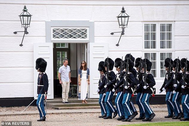 Mary and Frederik watched the action from their front door as they watched the ceremony on Friday.