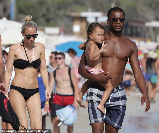 Evra initiated surprise divorce proceedings in 2020 after ending a 13-year marriage and moving away (pictured: Evra, his wife and daughter on holiday in Ibiza, Spain, in 2015)