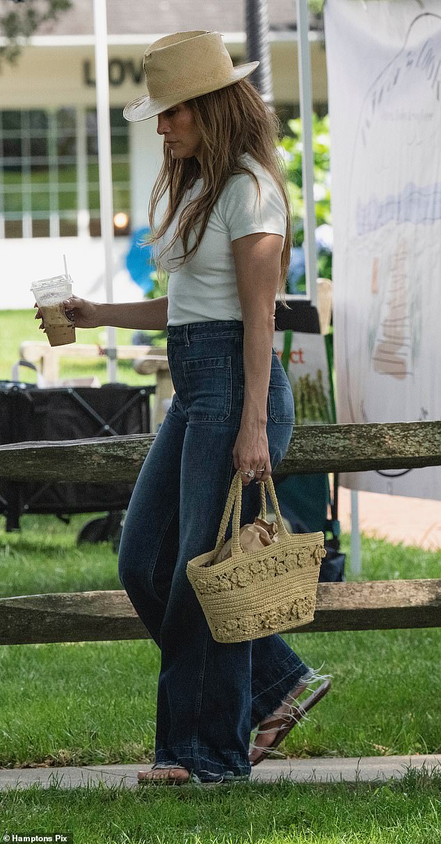 For her cruise through the Hamptons, Lopez opted for a casual, laid-back look with flared blue jeans and a white cropped T-shirt.