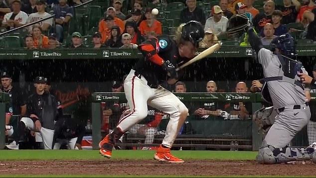 Kjerstad and the Orioles dugout react after his hit against the Yankees in a rainy Baltimore