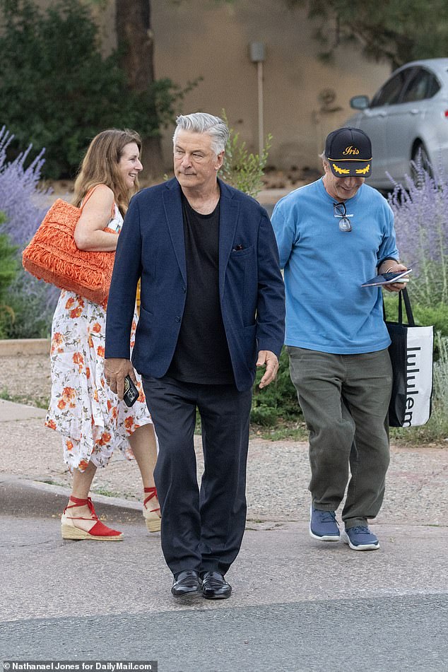 Alec's brother Stephen was dressed casually in a blue T-shirt and grey pants, carrying a Lululemon bag.