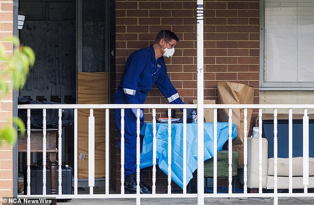 A forensic officer is seen at the Thomastown home following the alleged incident on Thursday.