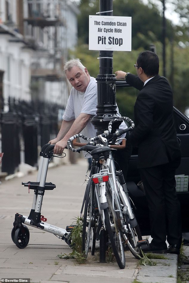 Eamonn's driver helped him out of the car.