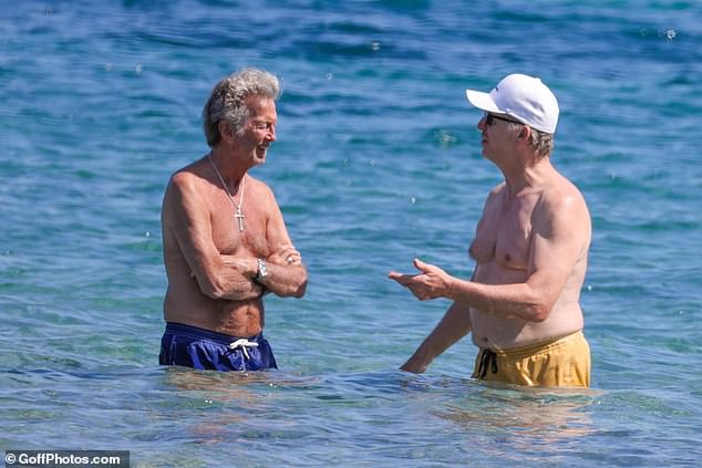 The £450million megastar, 79, who is rated as one of the greatest guitarists of all time, was spotted taking a dip in the sea.