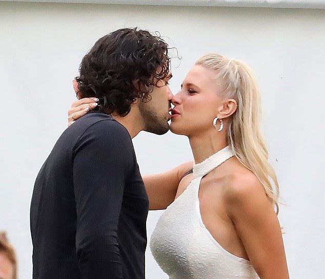 Graziano Di Prima kisses his wife Giada Lini, who is an Italian dancer