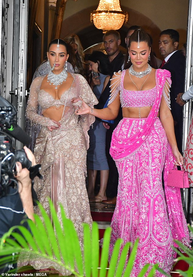 The reality star dazzled in a traditional gown embellished with intricate beaded detailing, while Khloe stunned in a dramatic pink ensemble.